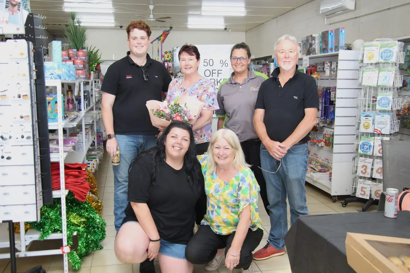FAREWELL: Former Shop 27 Varieties staff members Jess La Rose (left front) and Sharon Warren with Lachie Cooper (left back), owner Jackie Fraser, Lucy Lindsay and Brendan Fraser. PHOTO: Lynn Elder