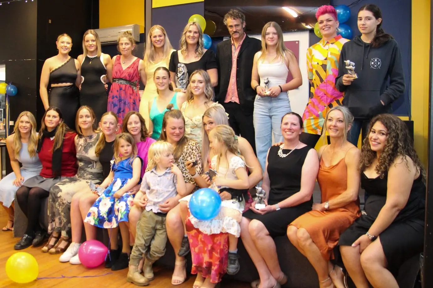 TEAM EFFORT: Members of the Eagles Women\\'s football team with coach and manager at their inaugural presentation last Friday night. PHOTO: Lynn Elder