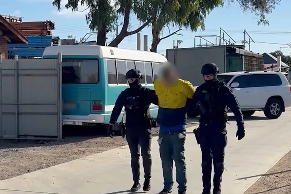 WALK OF SHAME: Police Critical Incident Response Team officers arrested this 32-year-old Wangaratta man in the rural city on Wednesday as part of a major crackdown on organised crime in the North East.