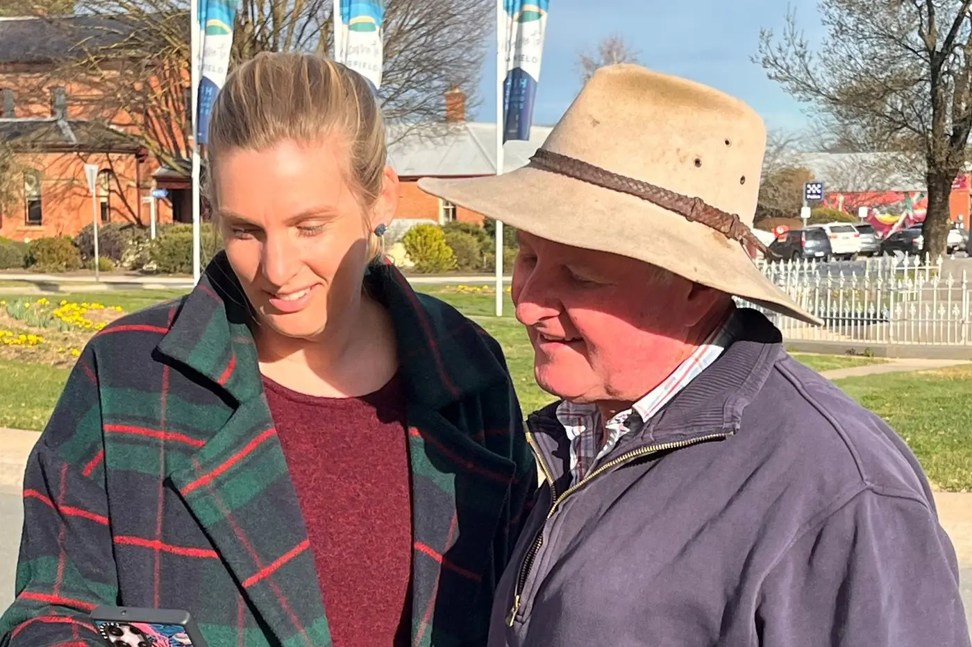 TOURISM VISIT: Franzi Weiss, Mansfield Shire Council Customer Service and Administrative Support Economic Development, shows Mayor Cr Steve Rabie the latest content on the @mansfieldmtbuller socials.