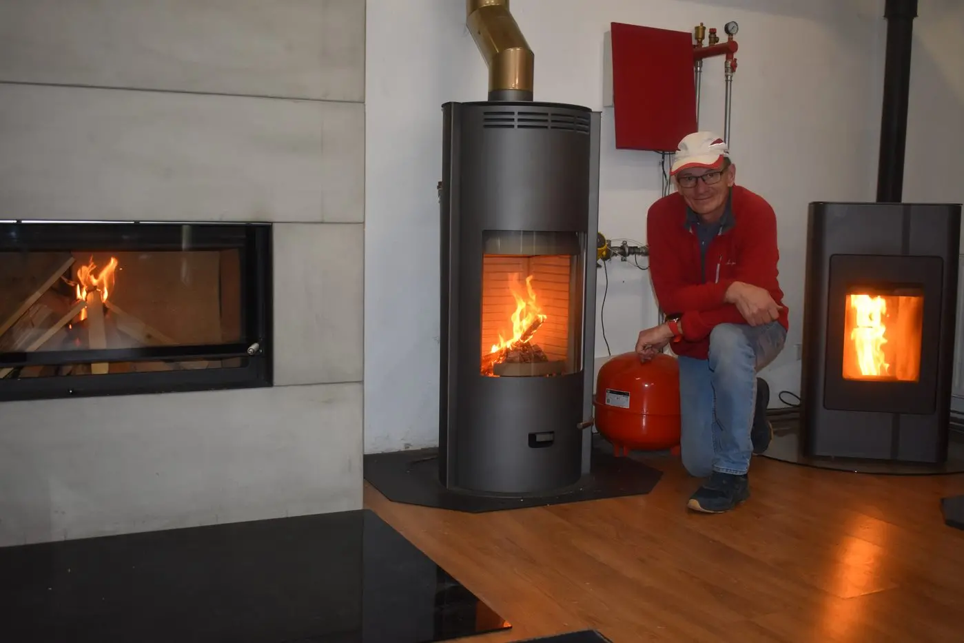 WARM WELCOME: Christian Bergmoser of Euro Fireplaces gives everyone a \\'warm welcome\\' to their showroom on Mt Buller Road with a range of heaters burning brightly for you to view. Id:25440