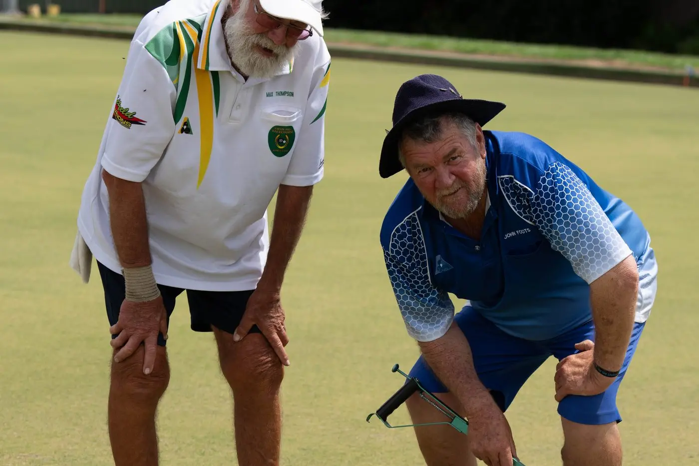 VICTOR : Trevor Thompson and John Foots take a closer look at the winning ball. PHOTOS: Ken Rainsbury.