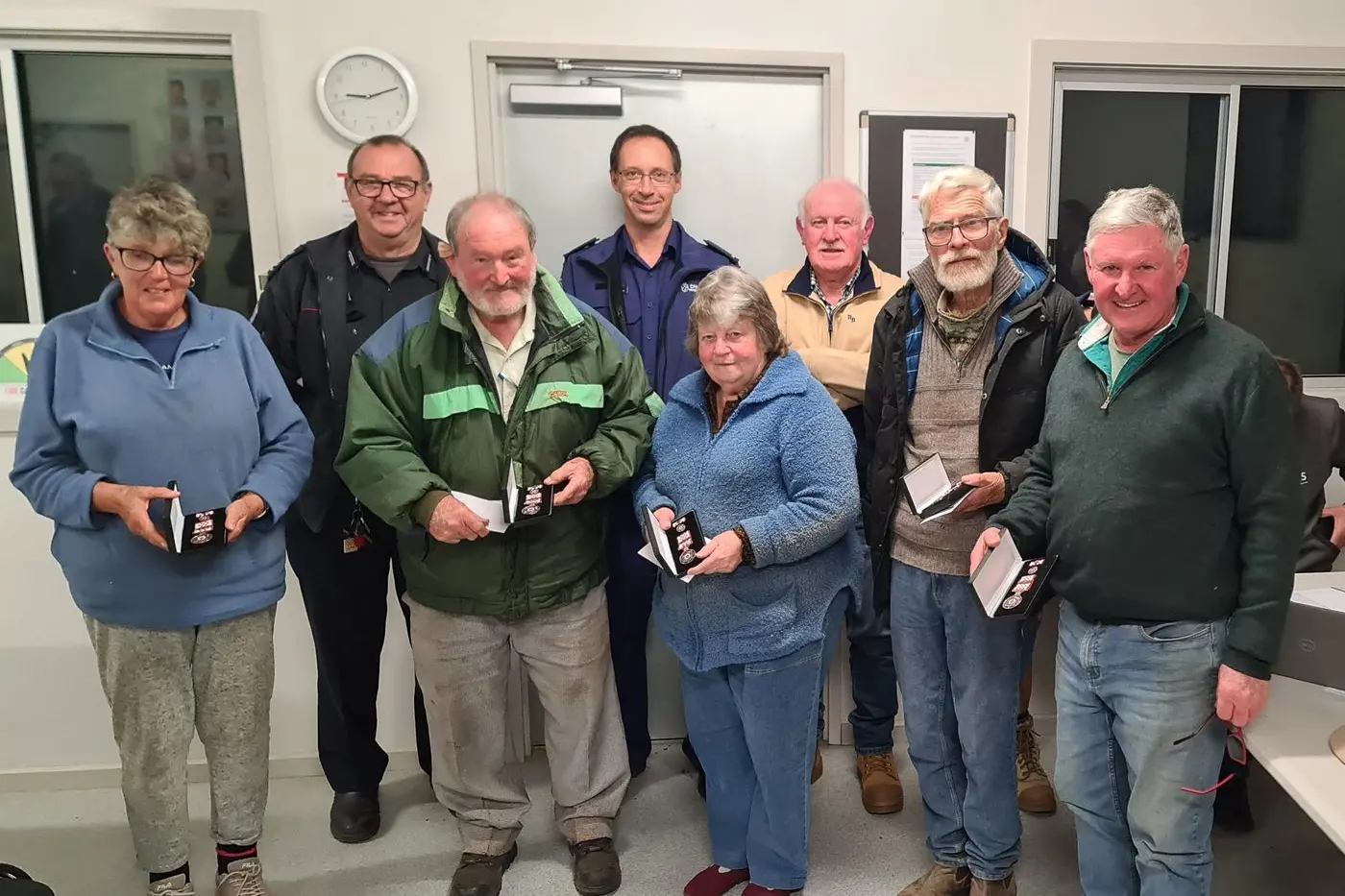 BARJARG CFA BRIGADE MANAGEMENT TEAM: (From left in front of CFA Commander Paul Scragg and Captain Andrew Cook) Amanda Marshall (30 years), Graham Tie (35 years), Joan Tie (30 years), Brendan Crowley (10 years), David Scott (45 years) and Steve Rabie (20 years).