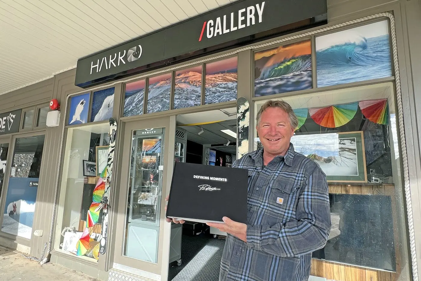 DEFINING MOMENTS: Photographer Tony \\u2018Harro\\u2019 Harrington outside his Mt Buller gallery with his latest publication.