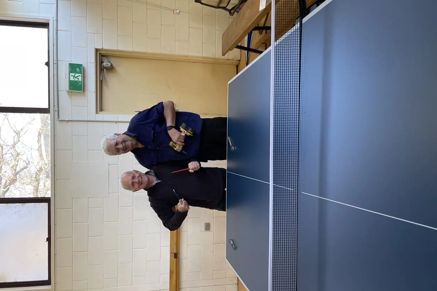 TERRIFIC TABLE: Jeff Curtis and Bob Carpenter celebrate their new table.