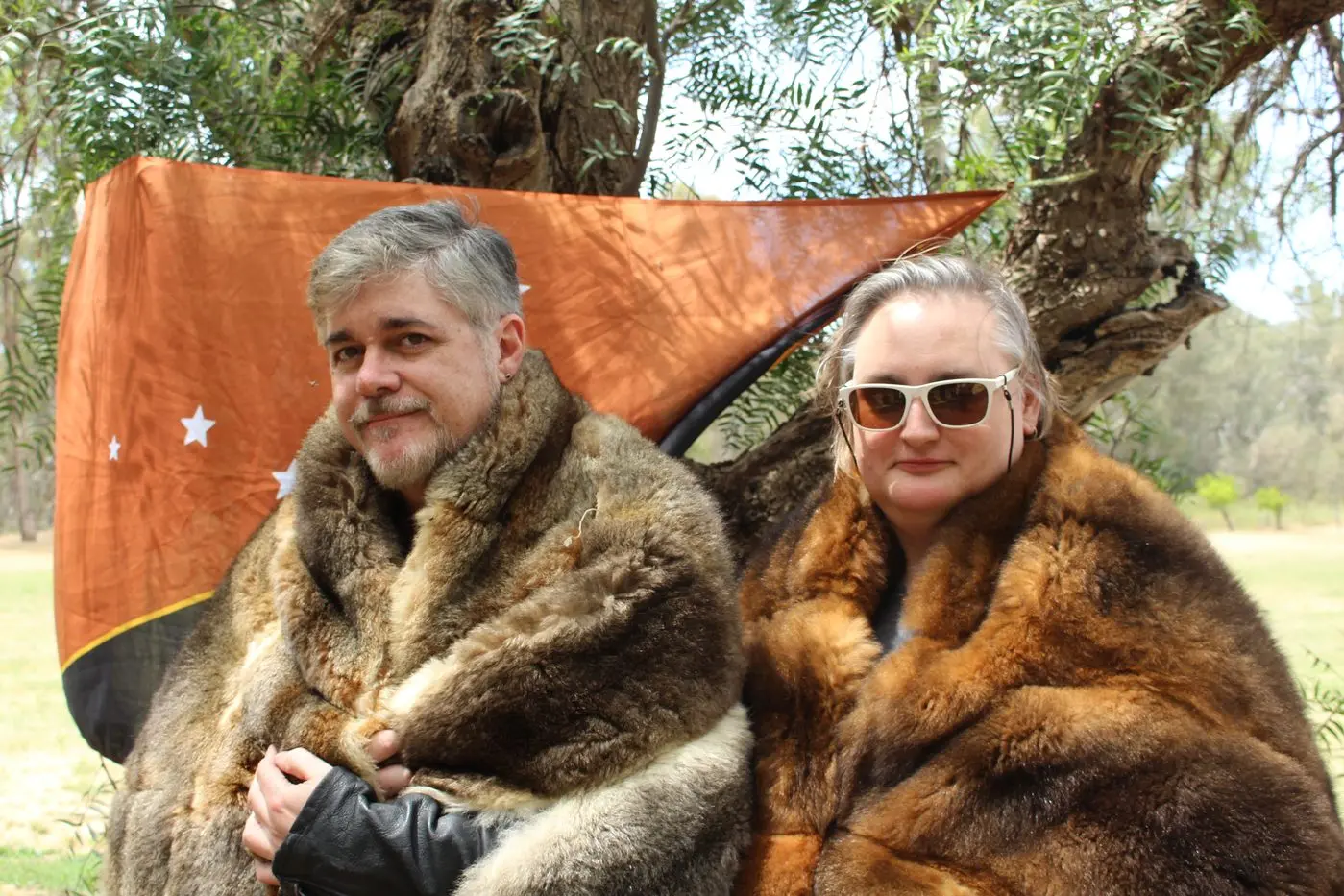 A QUEST TO REWRITE HISTORY: Director Darren K Hawkins and screenwriter Sara-Elizabeth Joyce were allowed to try on sacred possum cloaks by Taungurung elder Shane Monk. PHOTOS: Hannah Kennelly