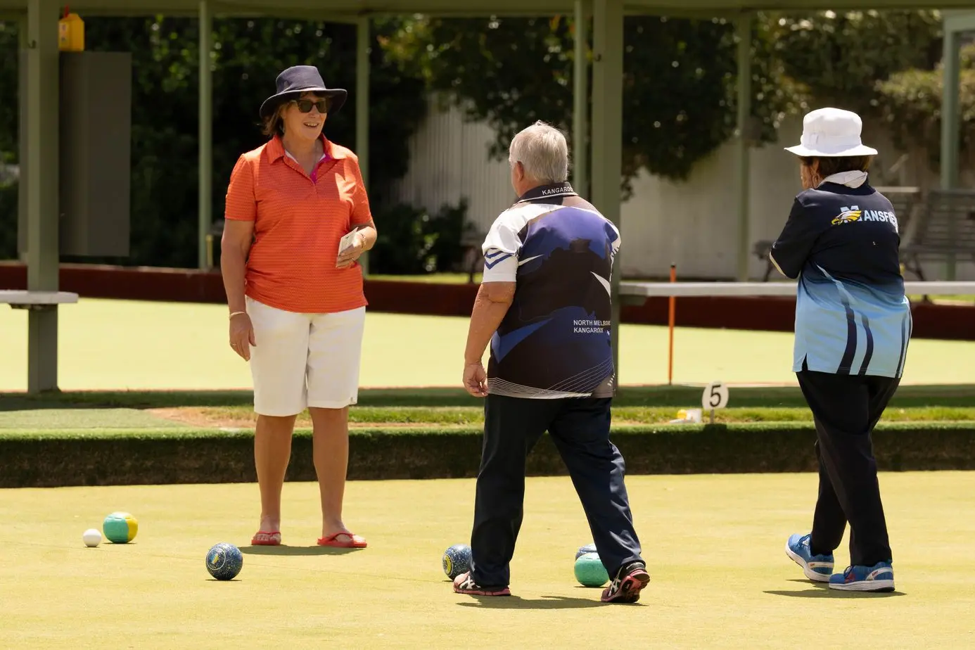 THIRTY-ONE ENDS: Lyn Foots and Irene Fuller walk to the winning bowl. PHOTO: Ken Rainsbury