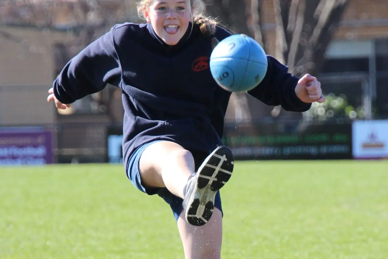 DROP KICK: Macey Thornton during a coaching session at Mansfield Primary School. PHOTO: Lynn Elder