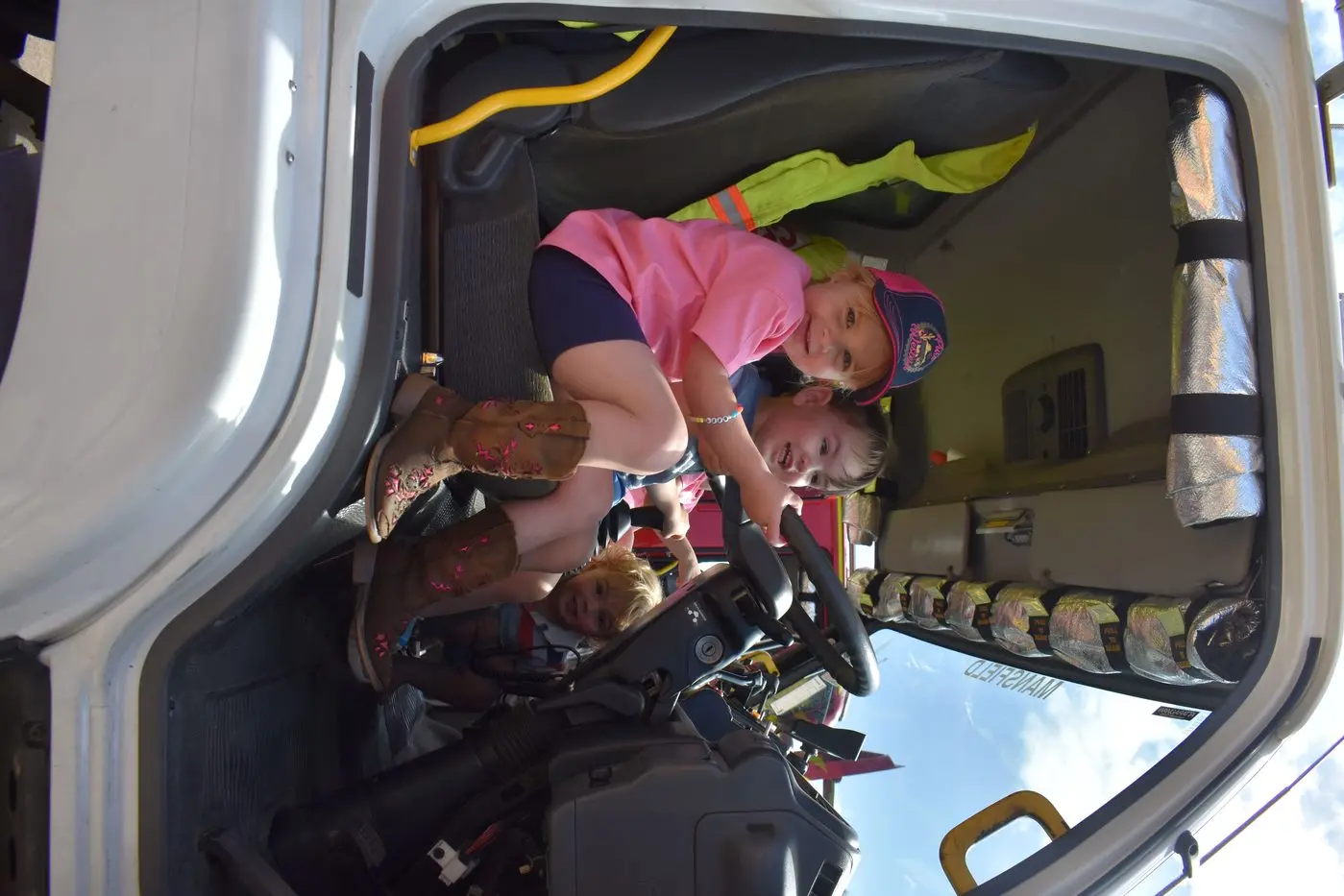 FUTURE DRIVERS: Amara Hoban and Sage Walker were trying out the CFA tanker for size at the brigade\\'s open day.