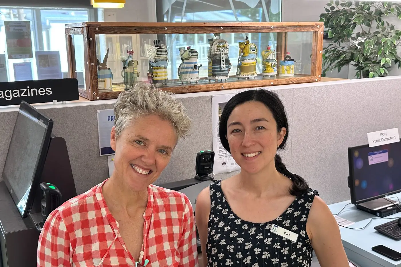 PEOPLE\\'S CHOICE: Artist Fleur Schell and Mansfield Library staff member Yuko Nishiyama \\nstand in front of The Fringe and its custom-made display cabinet. PHOTO: Supplied