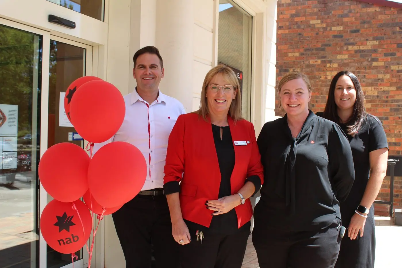 YOUR LOCAL BANK: (From left) Ryan Scarborough, home lending executive, Honey Richmond, customer adviser, Renee Leslie, branch manager and Erin Browning, customer adviser celebrate the branch returning to full trade.\\n