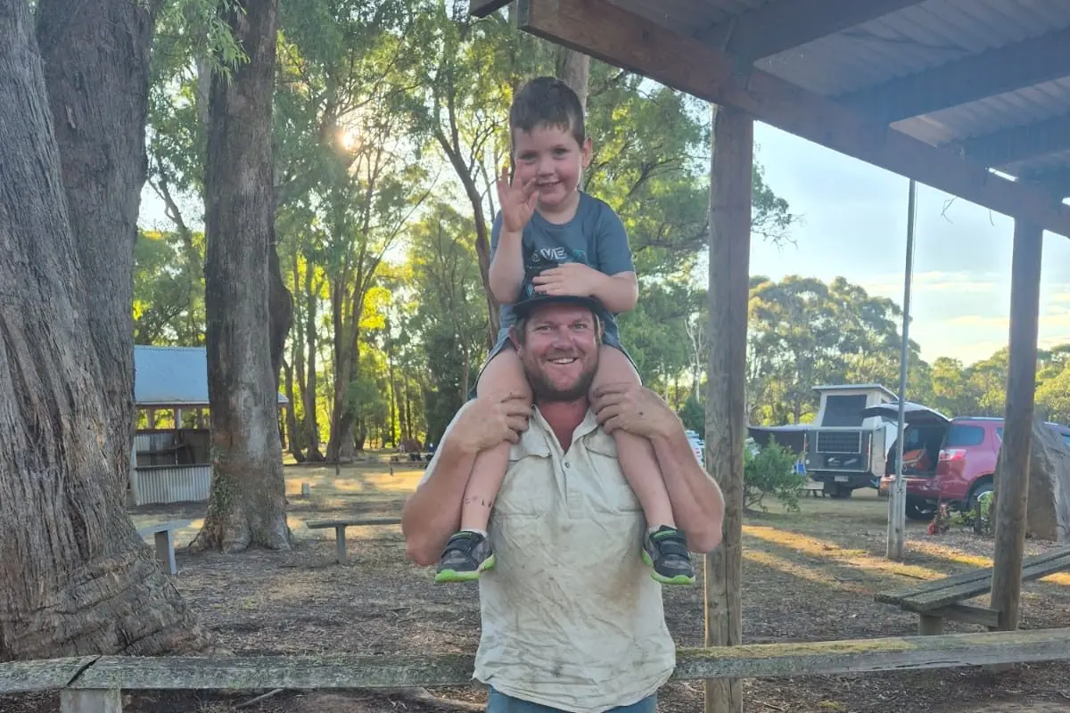LOTS OF SMILES: Granger Norris and dad Kyall enjoyed the night camping.