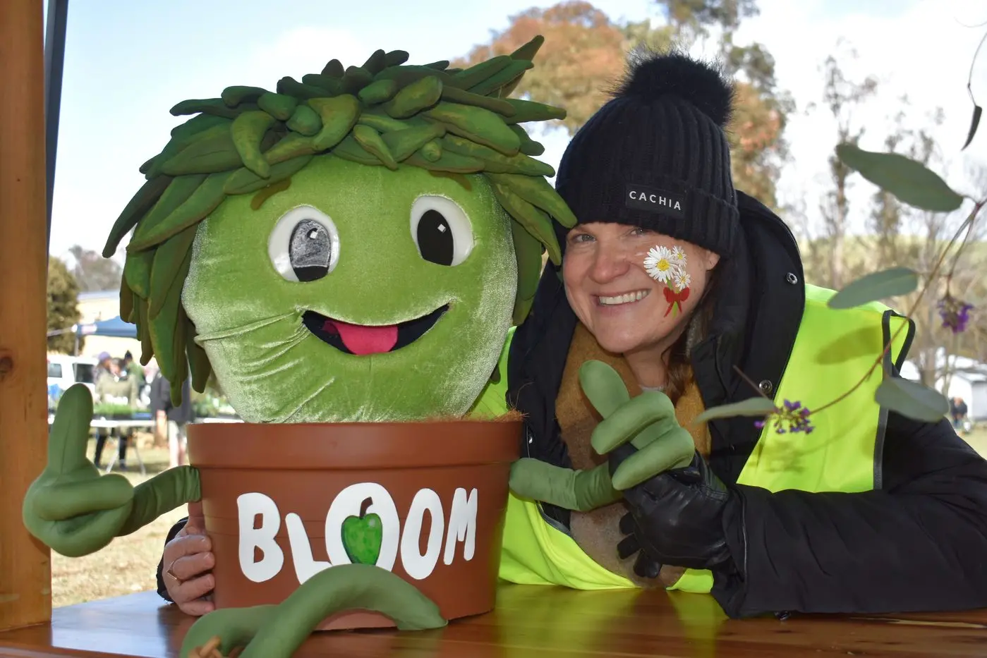 MEET ME: The Bloom@Doon mascot \\u201CBloom\\u201D was greeted by Bonnie Doon Centre manager Rachelle Kingsmore on Saturday \\u2013 encouraging visitors to vote for the scarecrow competition. PHOTOS: Pam Zierk-Mahoney
