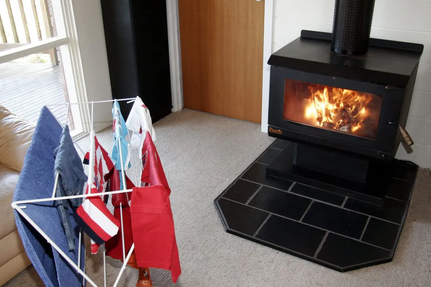 TOO CLOSE FOR COMFORT: A wood heater fire in Tatura caused extensive damage after bedlinen drying too close ignited and spread through the home. Authorities urge residents to keep flammable items at least one metre from heaters this winter.