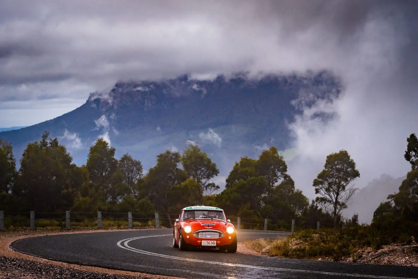 PICTURESQUE: Brian and Linda Dermott driving their Austin Healey in the Classics category of Targa Tasmania.  Id:24898