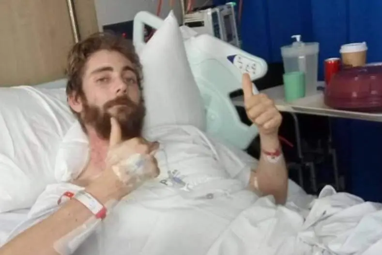 RECOVERING: Patrick Edwards (pictured) in hospital after surviving a horrific fall last August.