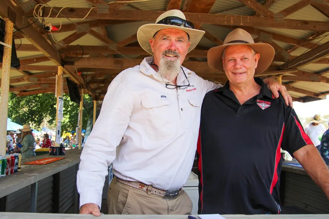 BAR NONE: Dave McMahon from Peppin Ridge Estate one of the sponsors and brother Russell supporting the Bonnie Doon Football Club efforts behind the bar. PHOTO: Lynn Elder