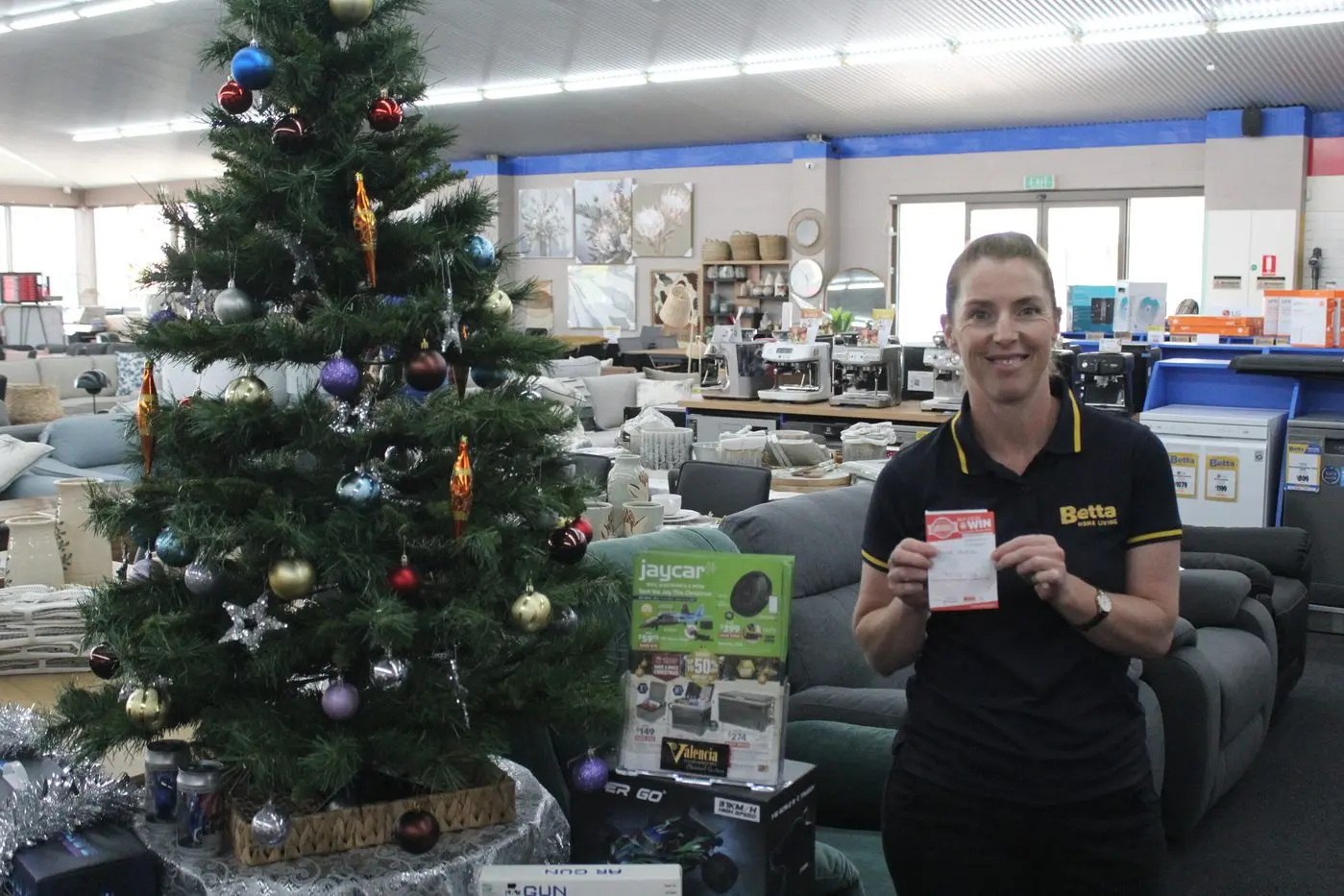 CHRISTMAS SURPRISE: Betta Electrical\\'s Lauren Lines (pictured) drew the entertainment package prize, with the winner being Sarah Anstee. PHOTOS: Samuel O\\'Brien