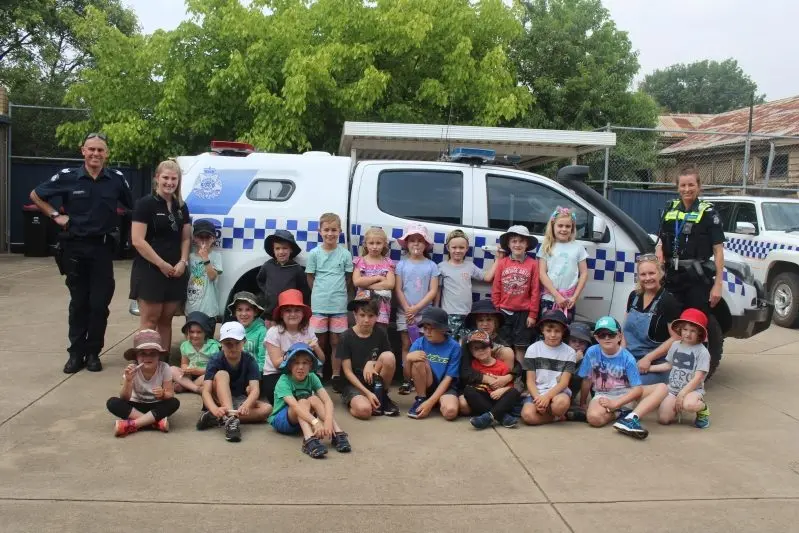 SIRENS BLARING: Senior Constable Kim Pelling and Sergeant Matt Bennett showed the Mansfield Cubby kids their police cars. PHOTOS: Sam Rouget