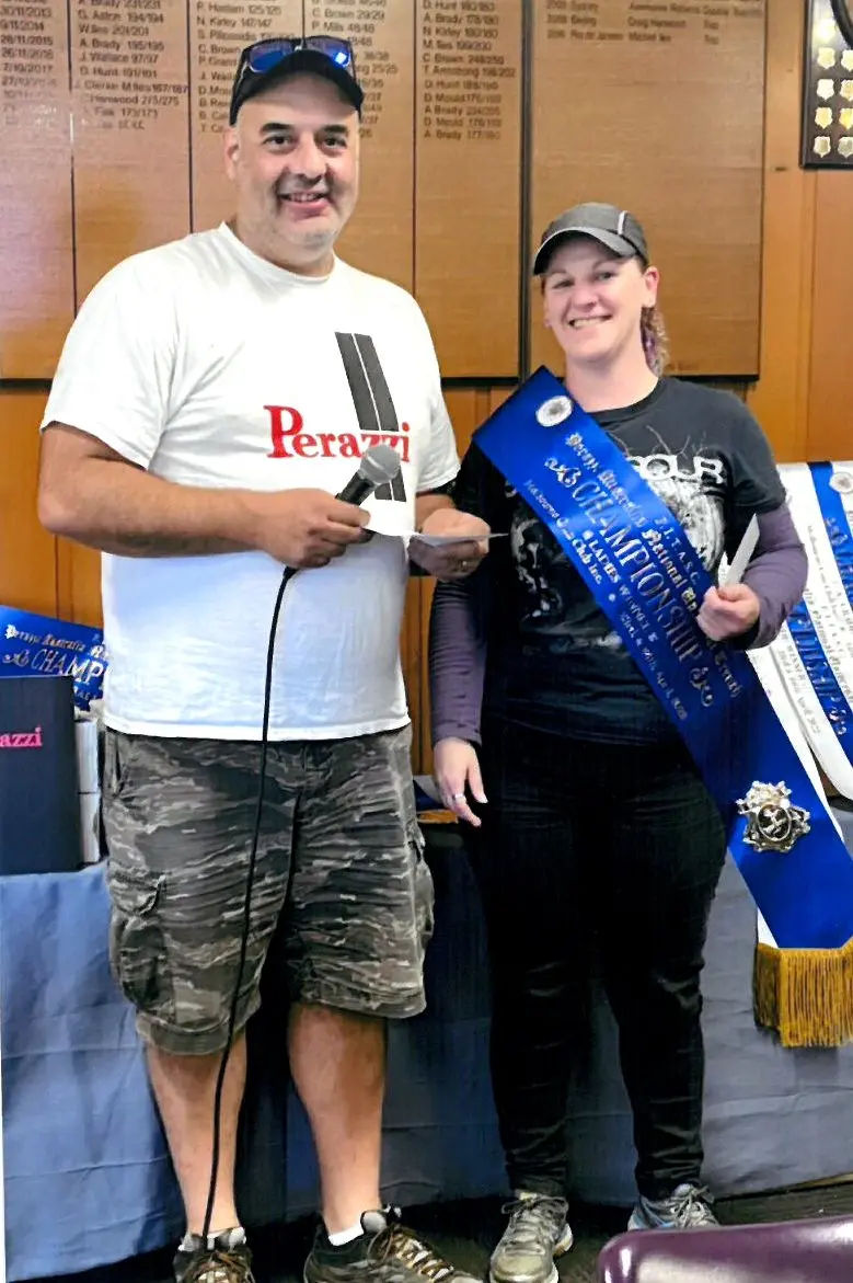 HIGHEST ACCOLADE: Coming off a break from shooting, Michelle Beecham was presented with her sash by Jeff Tonna. Id:23976