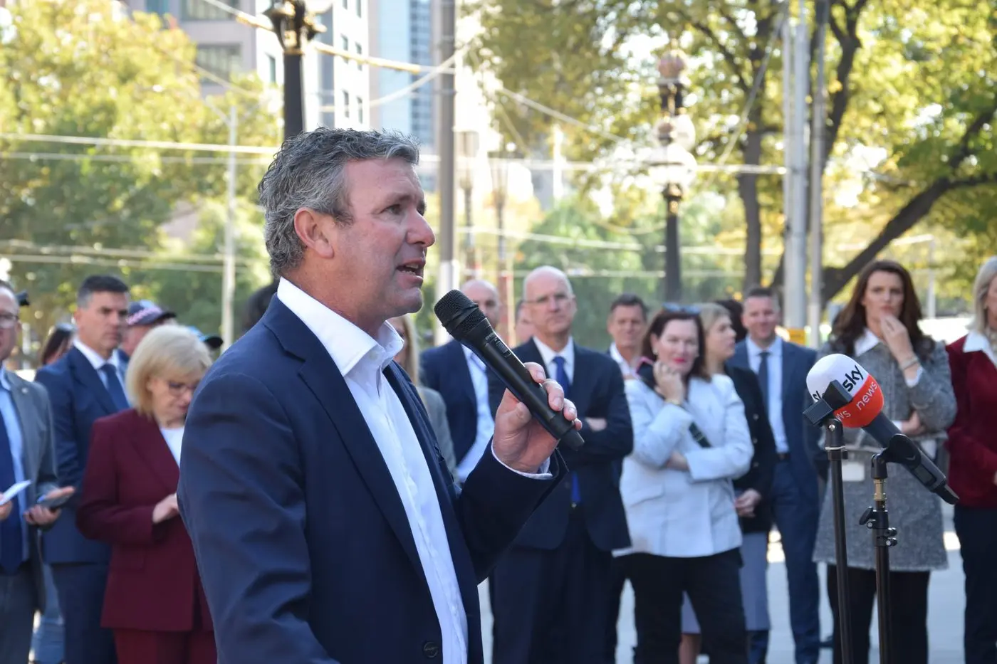 UNITED FRONT: VFF chairperson Brett Hosking speaking to the rally with Annabelle Cleeland and other opposition members listening in.