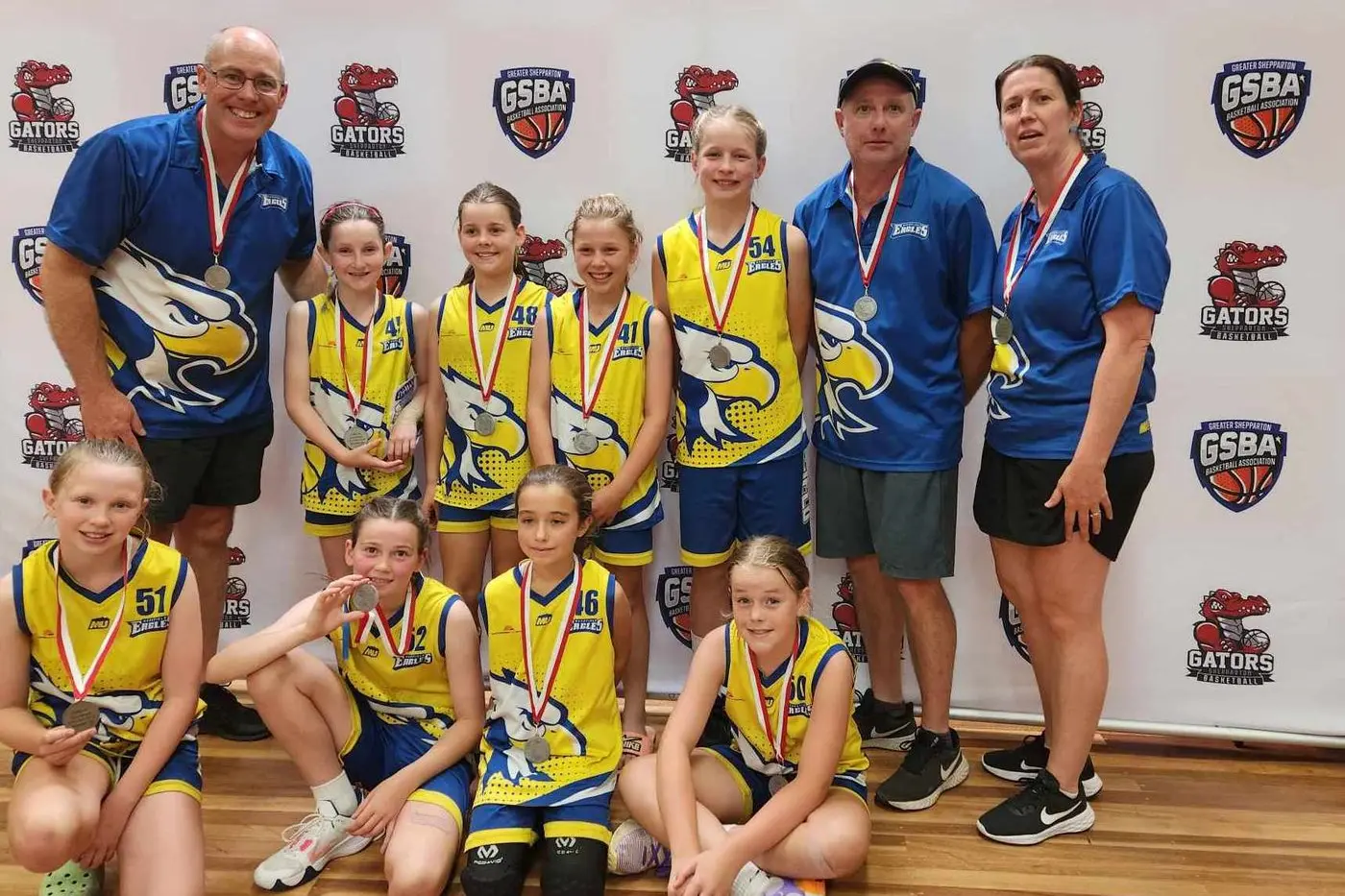 RUNNERS UP: (From left, back) Coach Glenn Thornton, Quinn Walsh, Kate Mercieca, Hannah Bruce, Assistant Coach John Harrop, Team Manager Bec Mills, (front) Lara Harrop, Matilda Mills, Scout Gardner and Macey Thornton.