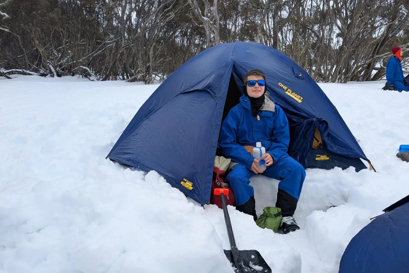 SNOW CAMP: Eamon Nealon enjoys his water air-chilled after setting up camp for the night at the Steiner School camp at the Bogong High Plains.