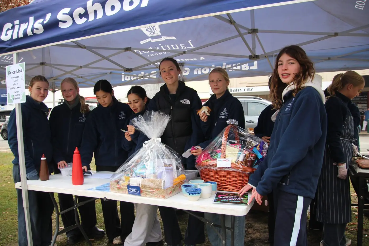 TEAM EFFORT: Lauriston students Lulu (left), Emily, Seline, Chica, Harriet, Abi and Zahra in action last week fundraising for the Jamieson Wildlife Shelter as part of their community service. PHOTO: Lynn Elder