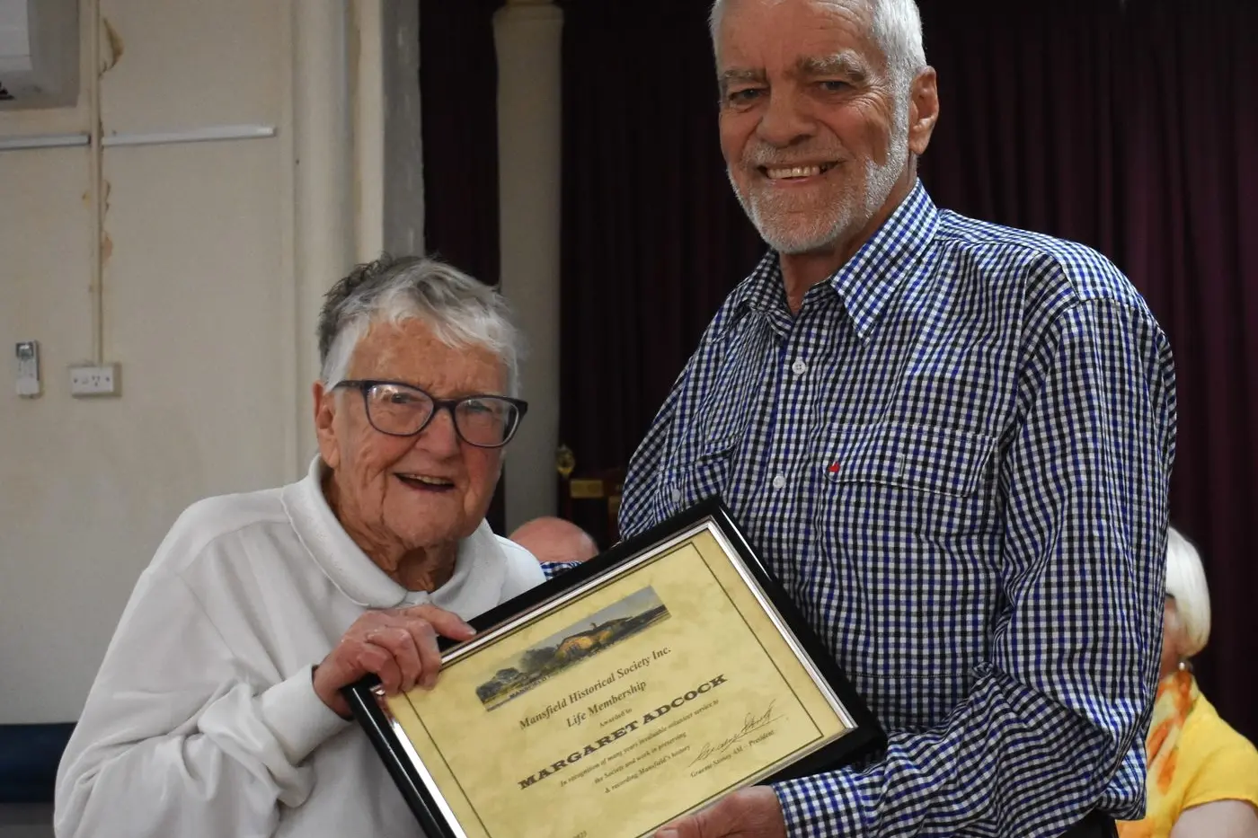 WELL DONE: Mansfield Historical Society president Graeme Stoney congratulates Margaret Adcock on her volunteering work with the society and presented her with a Life Membership on behalf of all members.  PHOTO: Pam Zierk-Mahoney