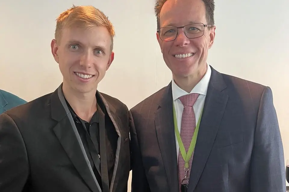 MEET AND GREET: (from left) Liam with former Olympic swimming champion Kieran Perkins. PHOTOS: Supplied