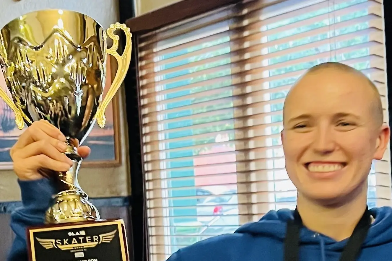 FIRST WOMAN: Hayley Wilson with her surprise award for Australia\\'s Skateboarder of the Year for 2024. PHOTO: Catriona Wilson