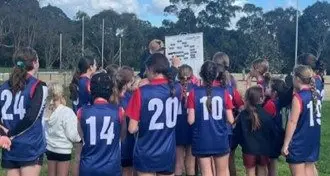 Mansfield Primary School girls positive footy finals debut