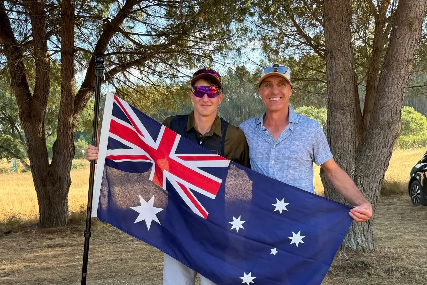 <p>ON TOP OF THE WORLD: Nate Palubiski with dad Simon holding the Australian flag after Nate\\'s junior world champion triumph in Portugal in July. </p>\\n