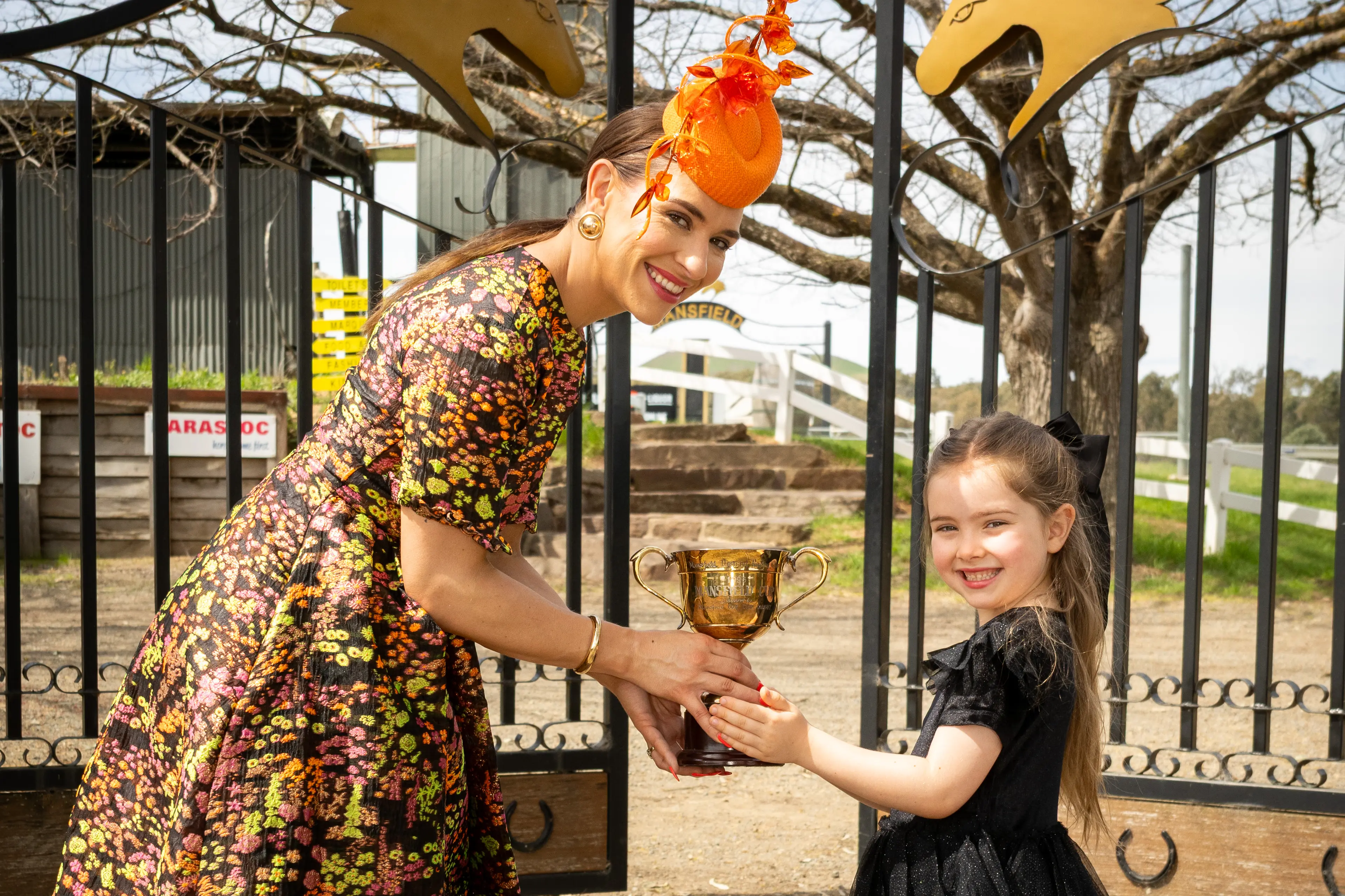 <p>RACING IN STYLE: Adrianne, MDRC Fashions Ambassador, and Mahli are ready for the races.</p>\\n